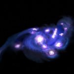 Lente gravitacional revela “Uvas Cósmicas” do início do Universo